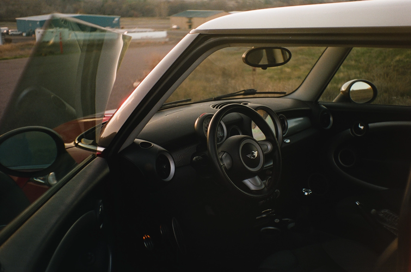 A photo of the interior of a red mini cooper