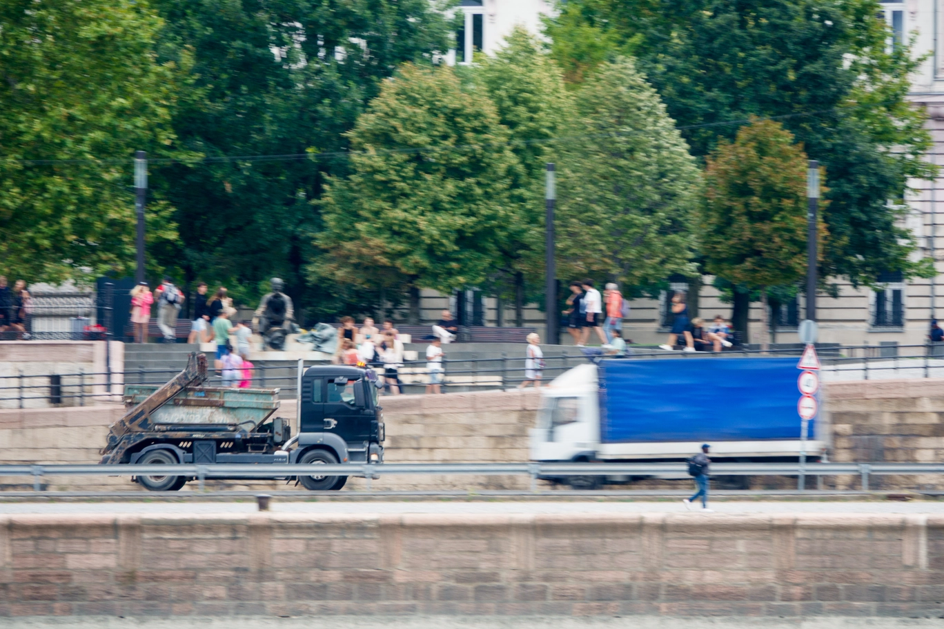 A photo of two trucks