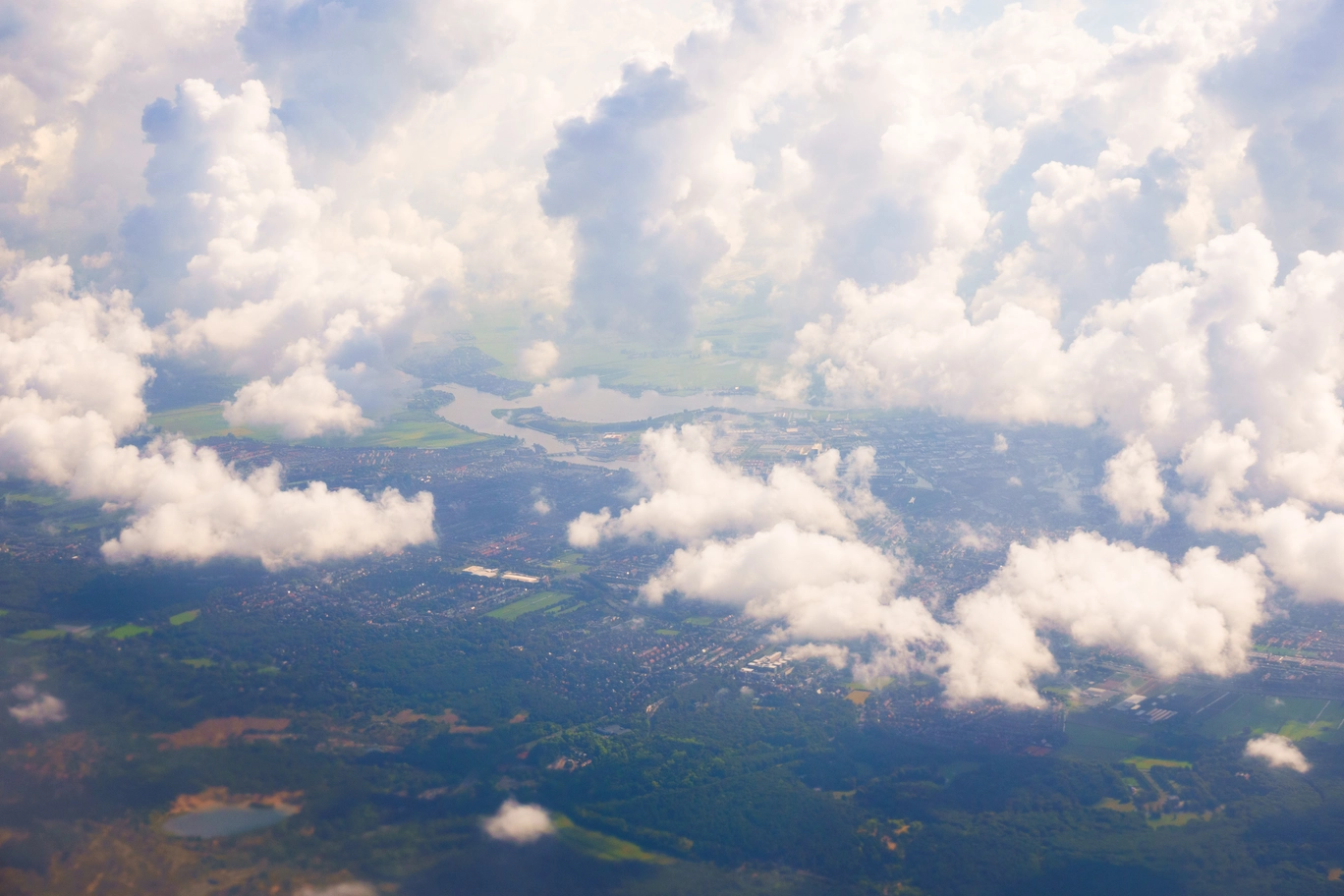 An arial photo of a town and clouds