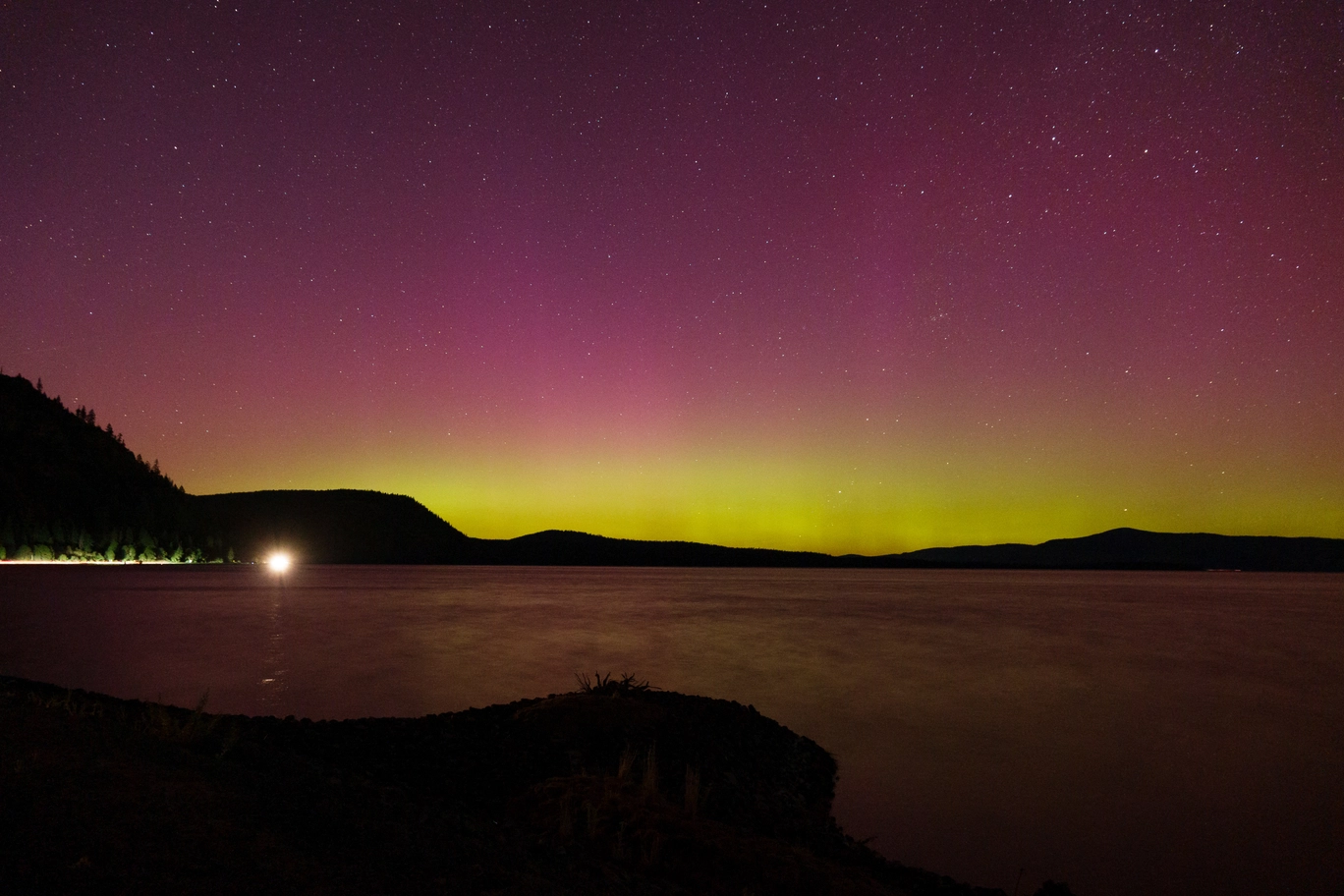 A photo of the aurora borealis and Klamath lake