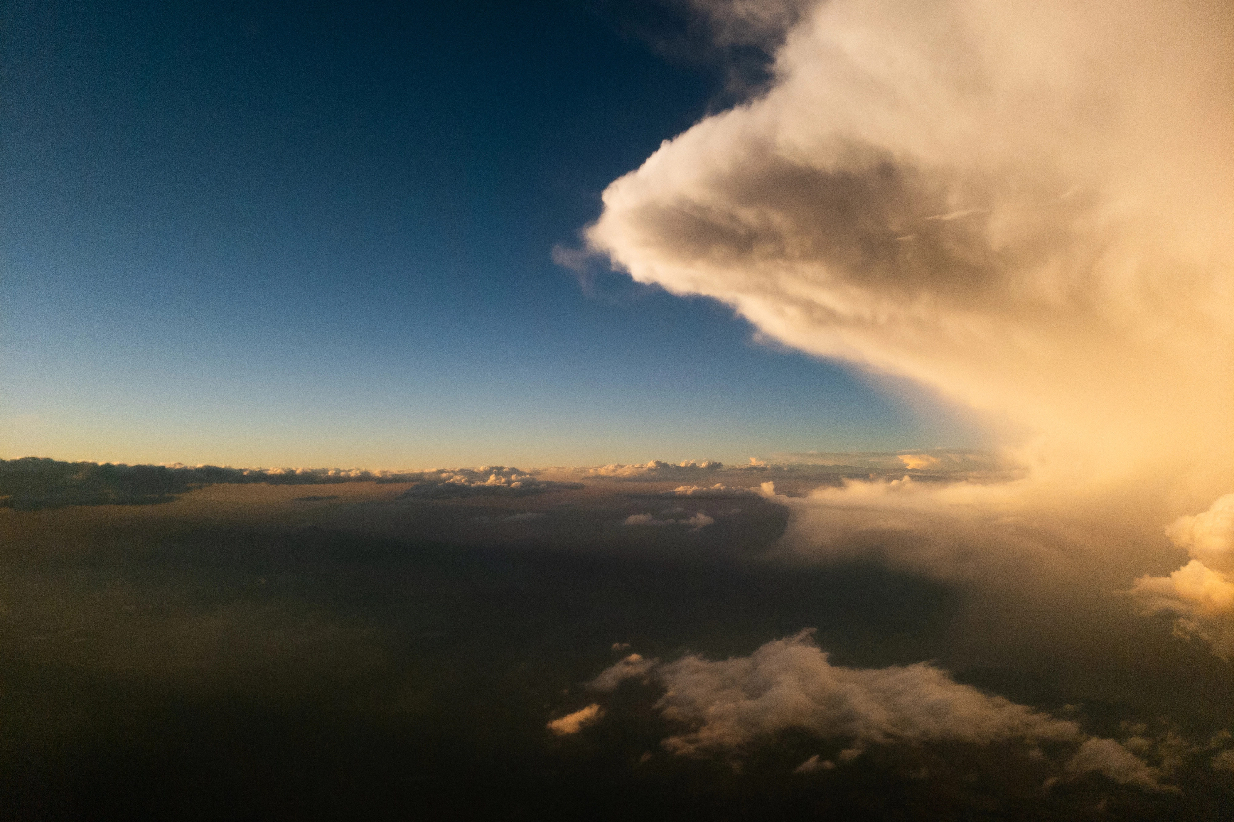 A photo of a big cloud from an airplane