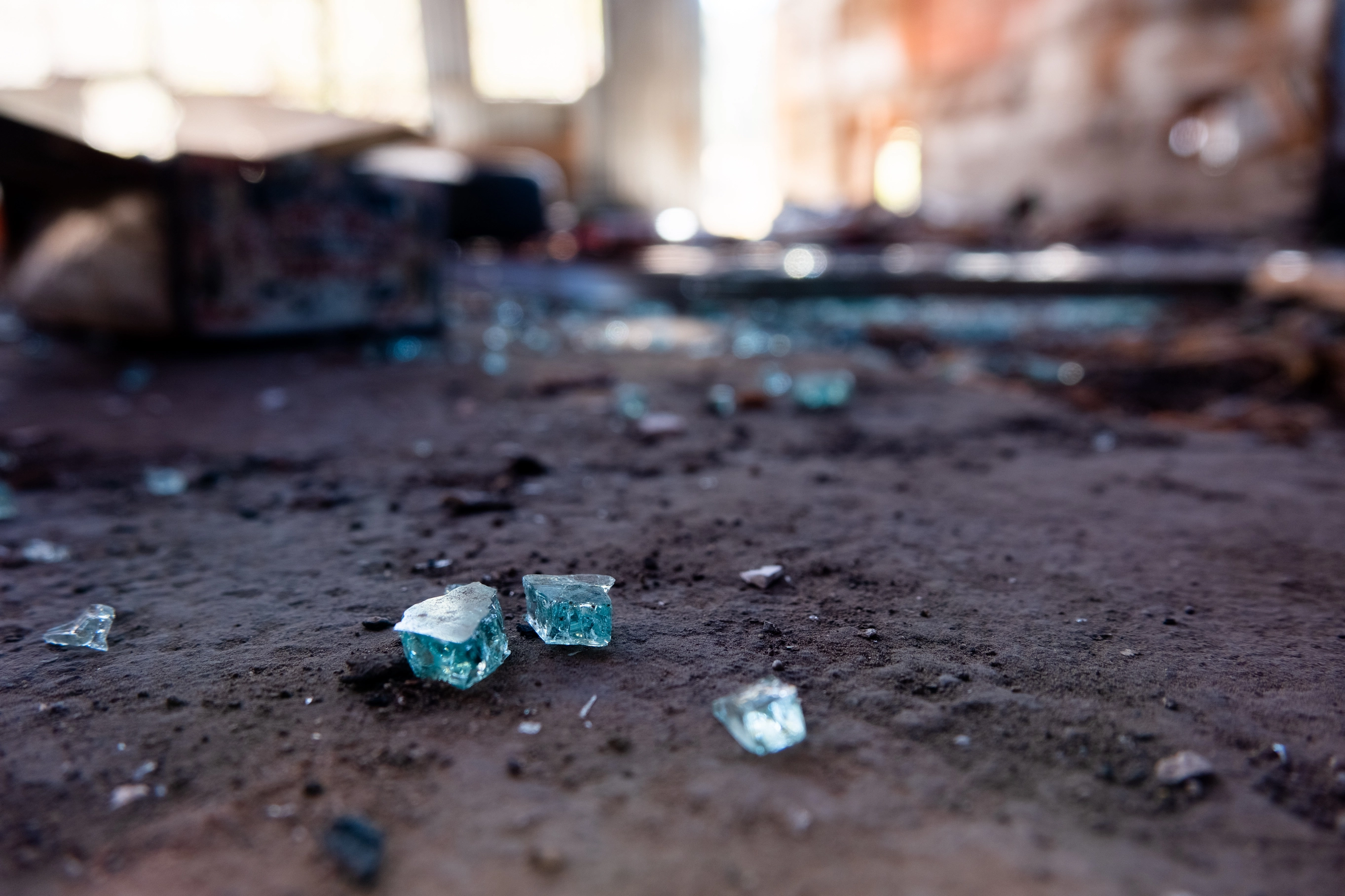 A macro shot of broken glass in an abandoned building