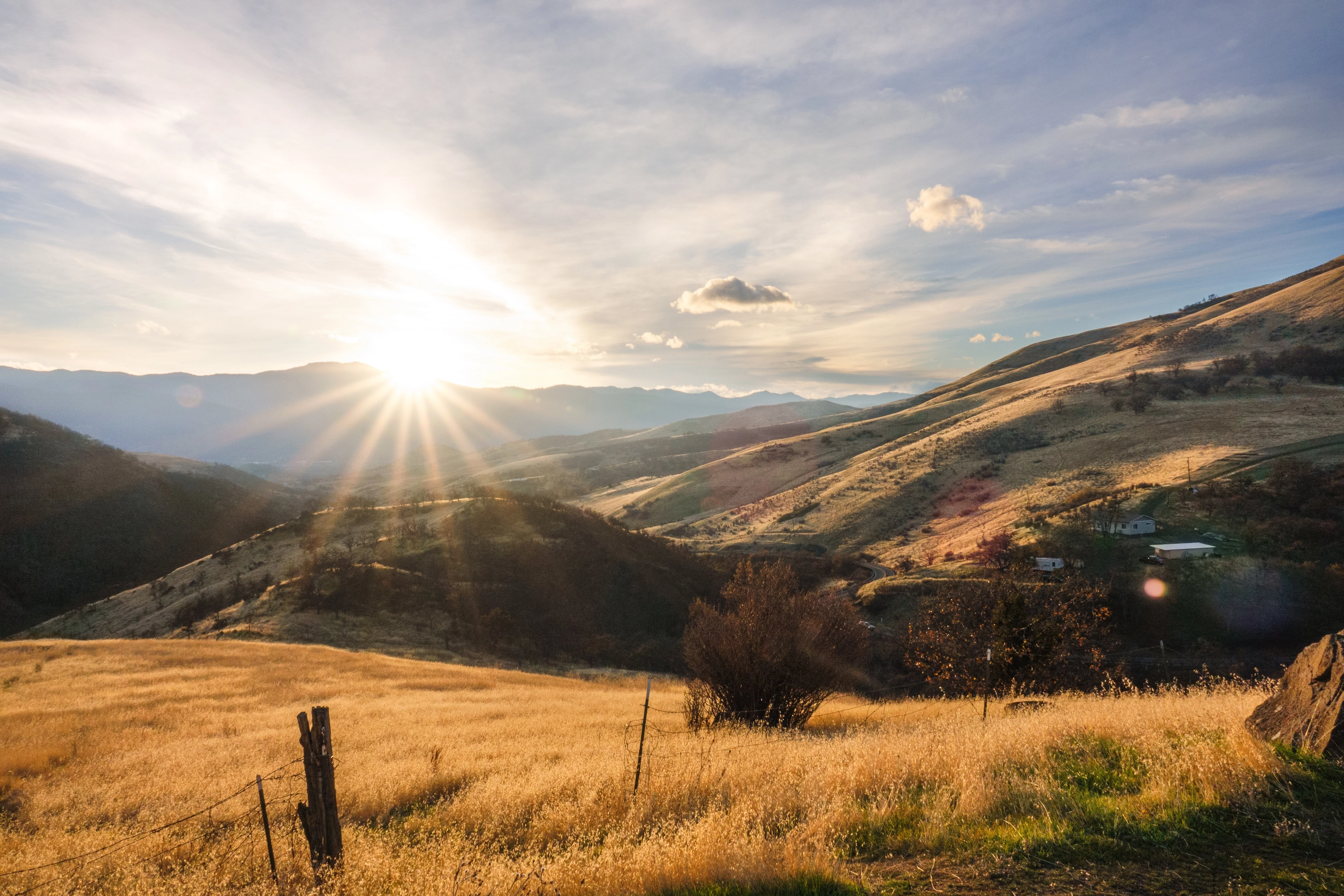 A photo of the sun setting over the rogue valley